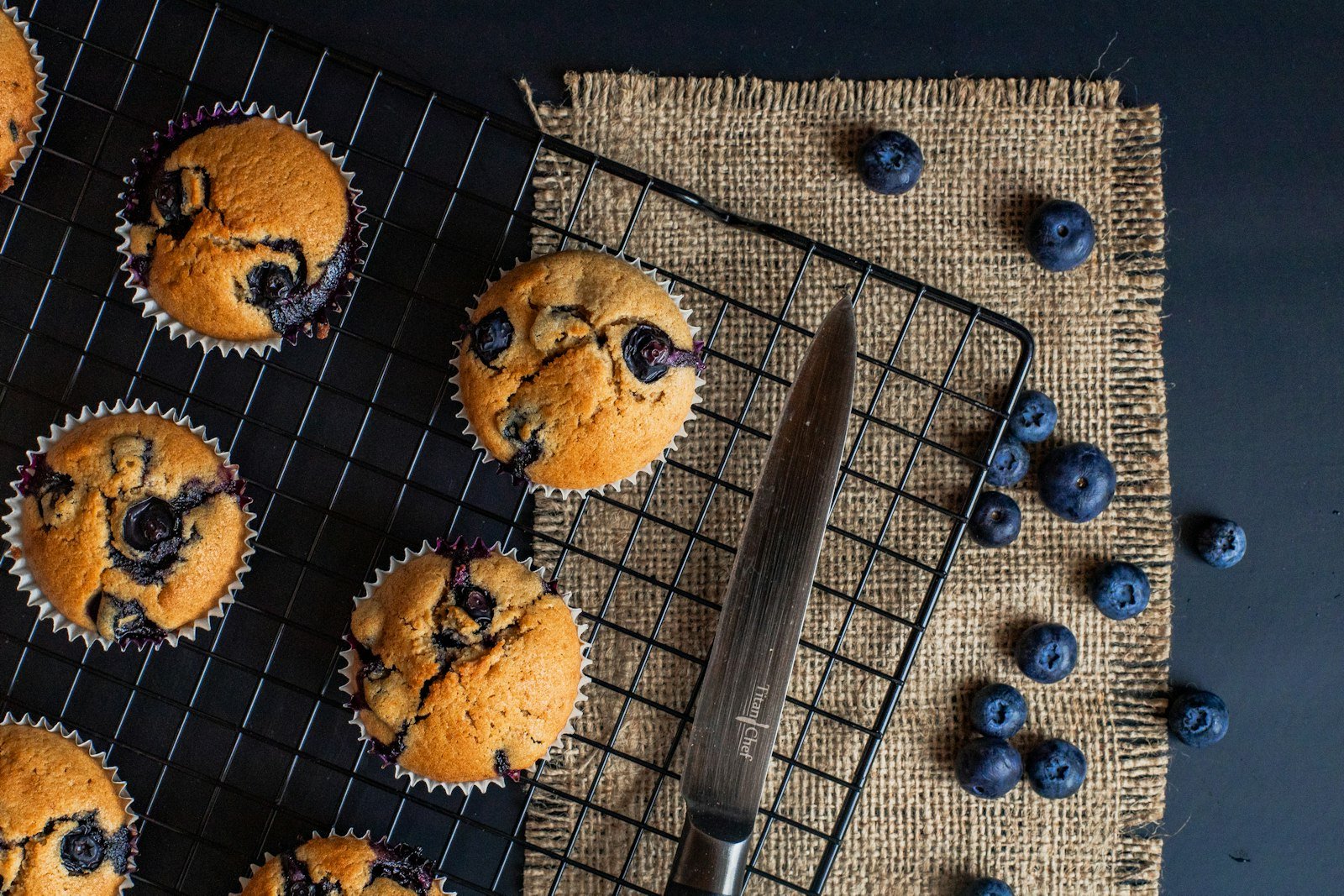 A batch of blueberry baked oatmeal cups cooling on a wire rack