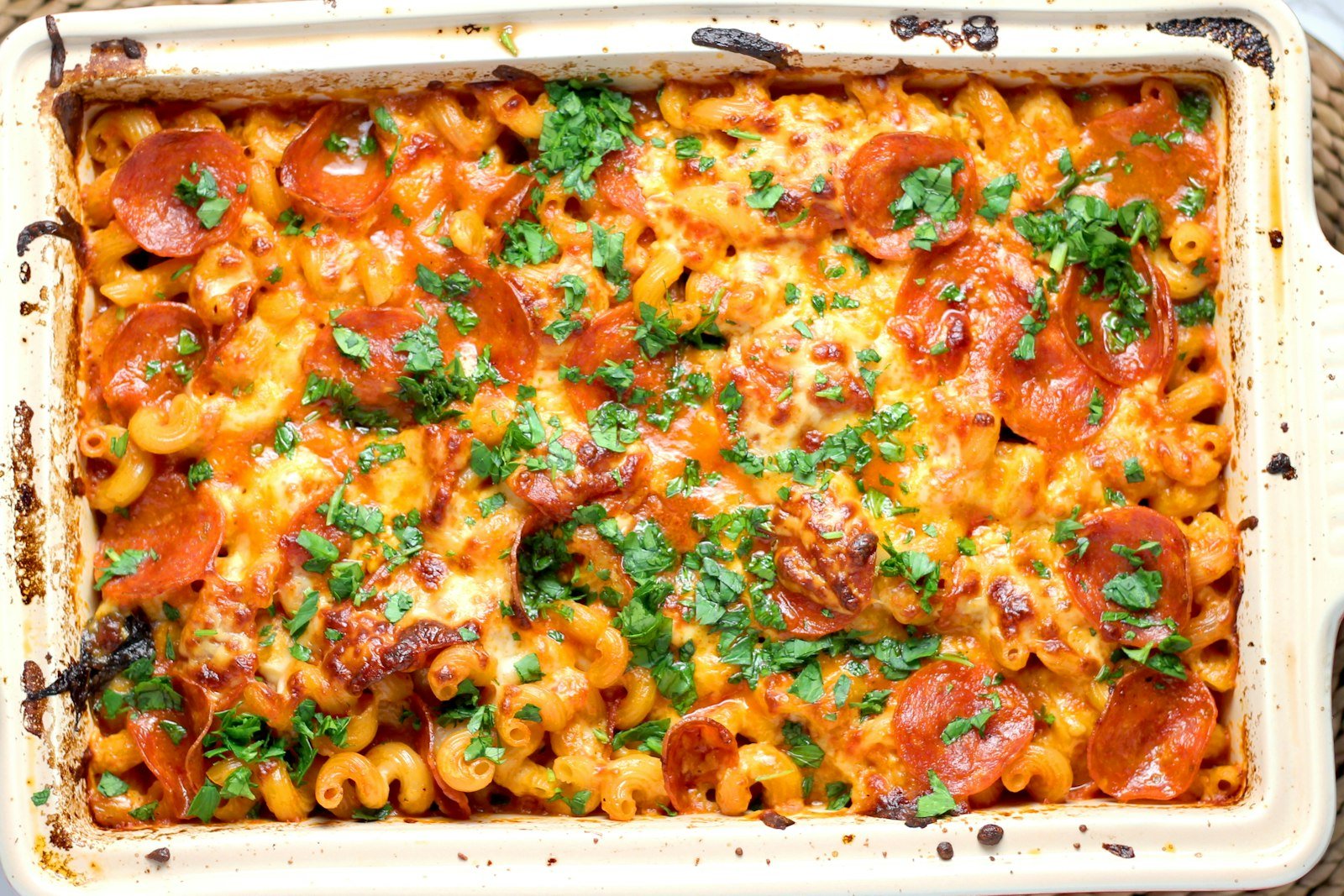 Cheesy chicken pasta casserole in a baking dish