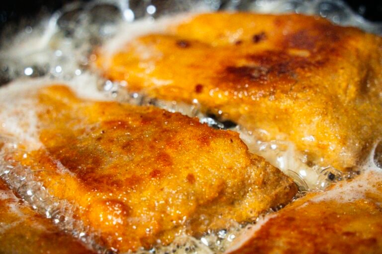 Golden seared chicken in a skillet, one of the 30-minute meals