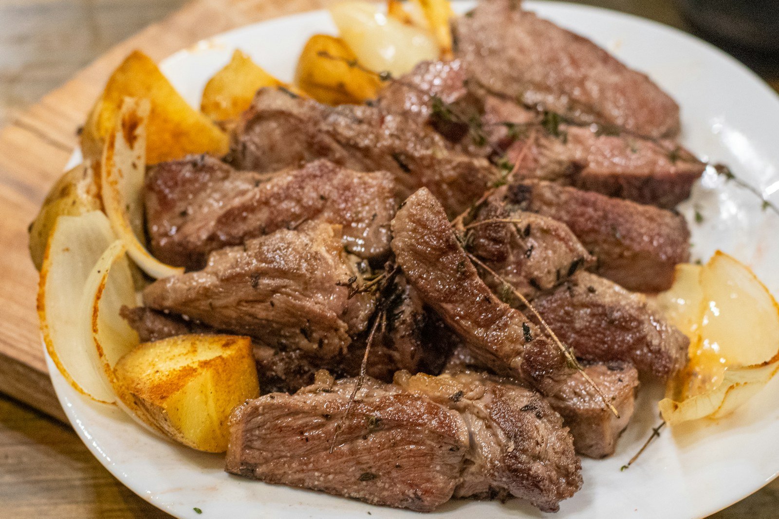 Fork-tender slices of slow cooker pot roast with potatoes